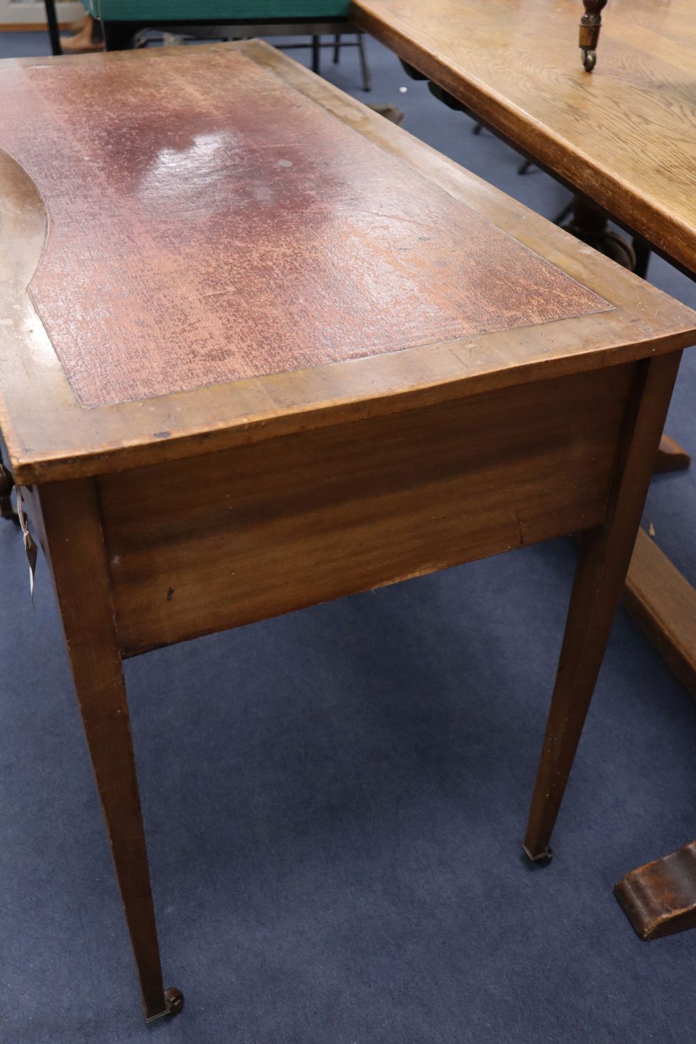 An Edwardian satinwood banded mahogany writing table, the concave front 98cm